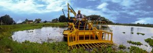 WeeDoo harvesting the floating weed Water Lettuce in a Central Florida lake