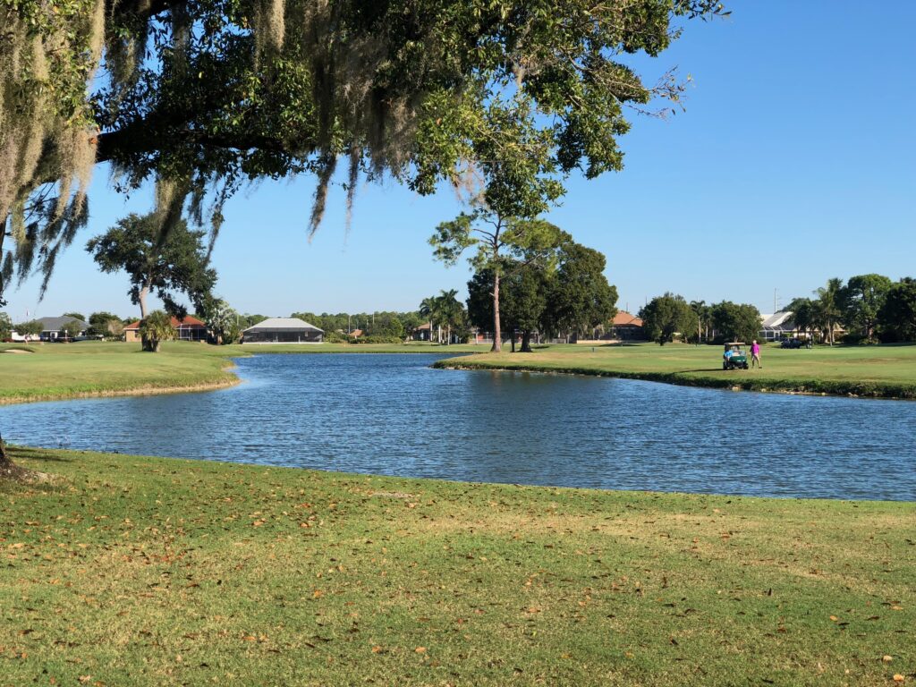 Large lake in the middle of a golf course.